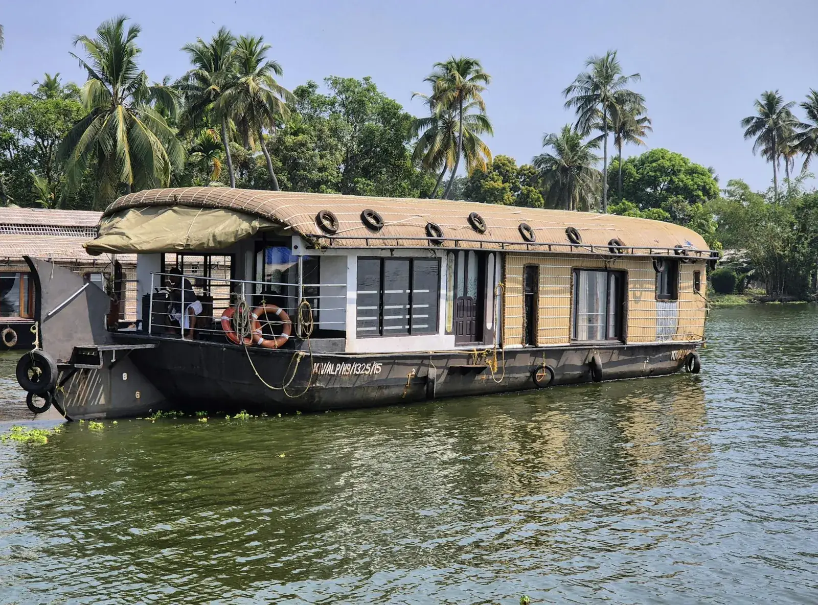 Kerala houseboats moored among palms — Alleppey backwater holiday package